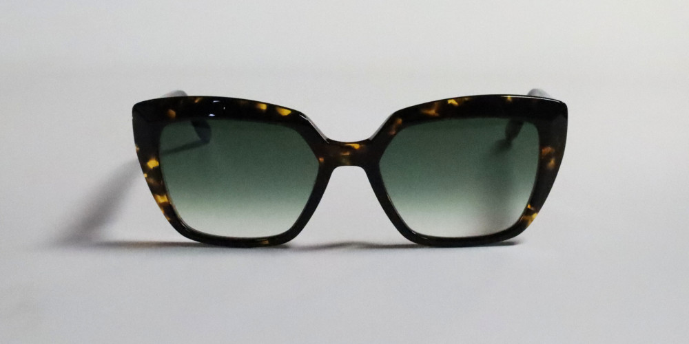 occhiali da sole tartarugati con lenti verdi e montatura spessa linea Bernabei
