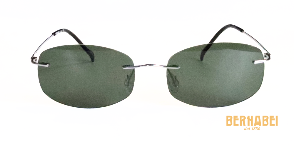 Occhiali da sole con lenti rettangolari verde scuro e struttura in titanio